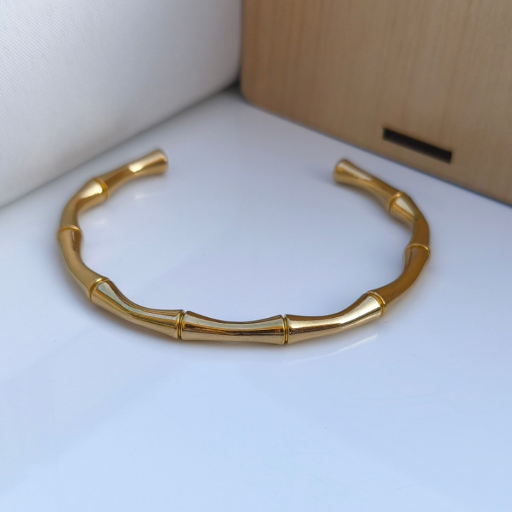 خرید دستبند پسرانه طرح اسکلت طلایی استیل رنگ ثابت شیک