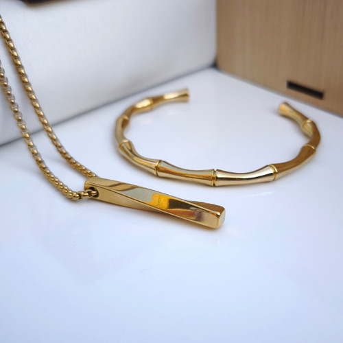 خرید ست دستبند گردنبند پسرانه طلایی استیل رنگ ثابت